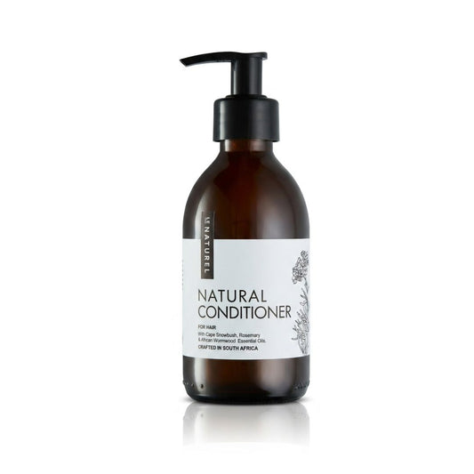 Brown conditioner bottle with pump and white label on a white background