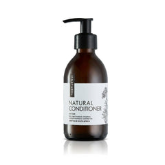 Brown conditioner bottle with pump and white label on a white background