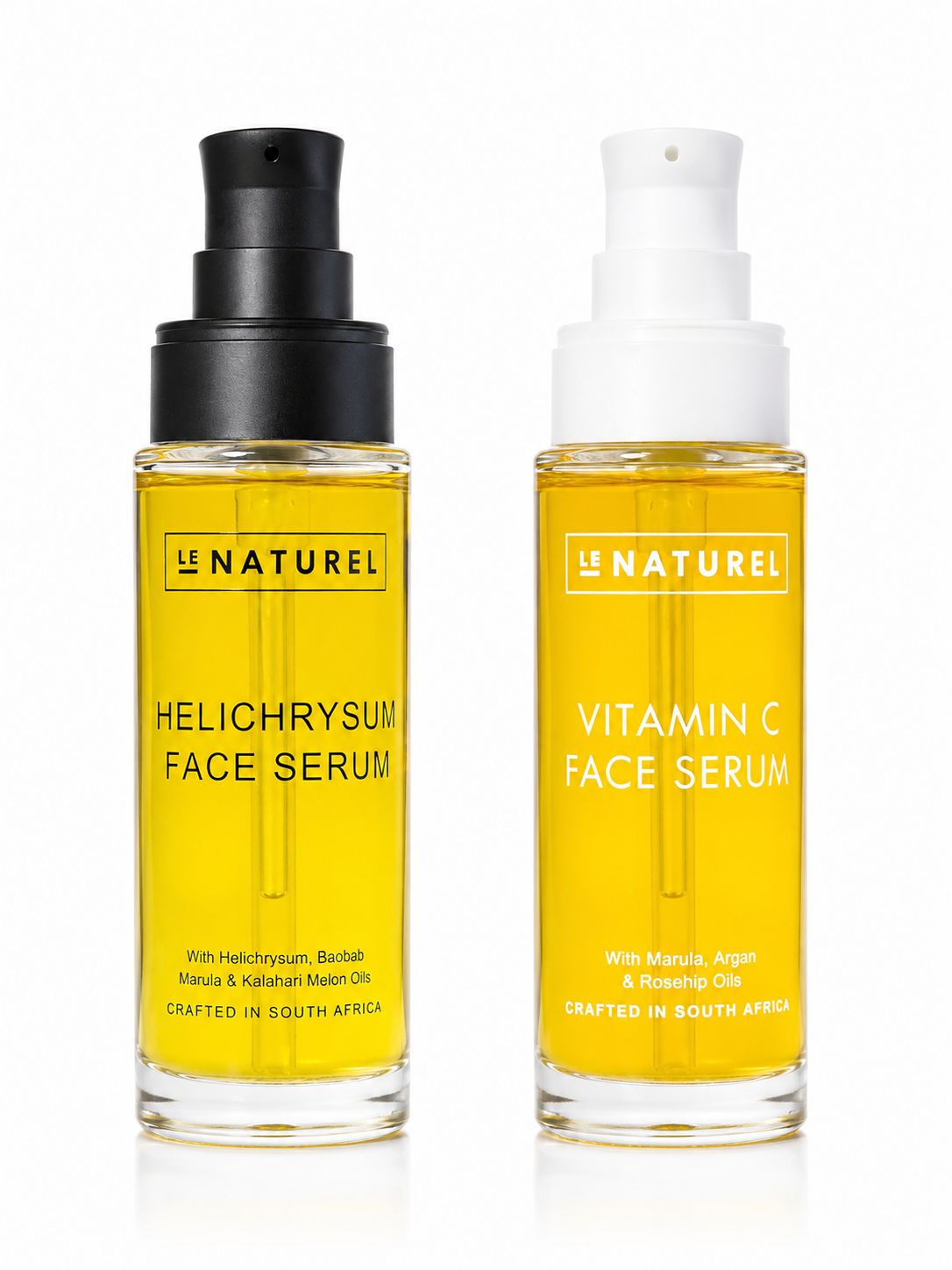 Two bottles of Le Naturel face serum, one Helichrysum and one Vitamin C, on a white background.