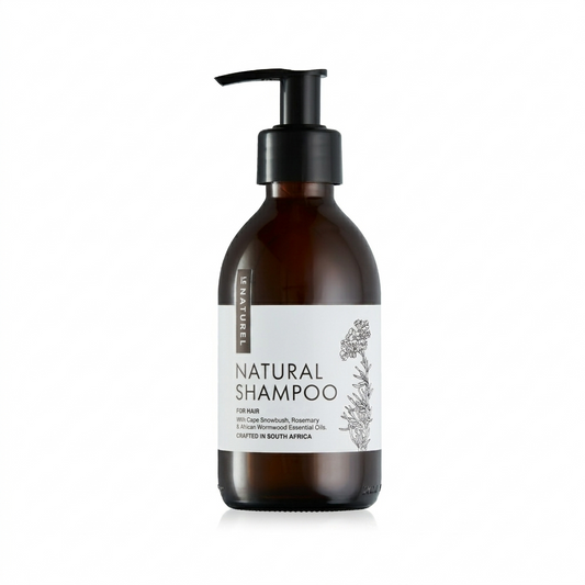 Brown bottle of natural shampoo with a pump on a white background